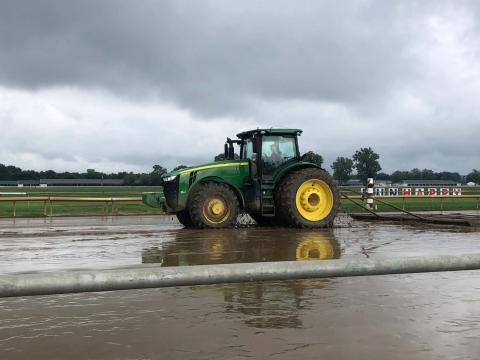 The Ellis Park maintenance crew, including track superintendent Javier Barajas driving this tractor, immediately went to work to prepare the track for Sunday's racing.