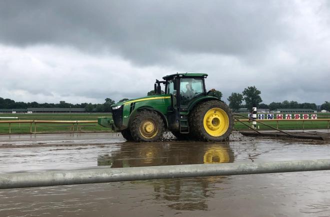 The Ellis Park maintenance crew, including track superintendent Javier Barajas driving this tractor, immediately went to work to prepare the track for Sunday's racing.
